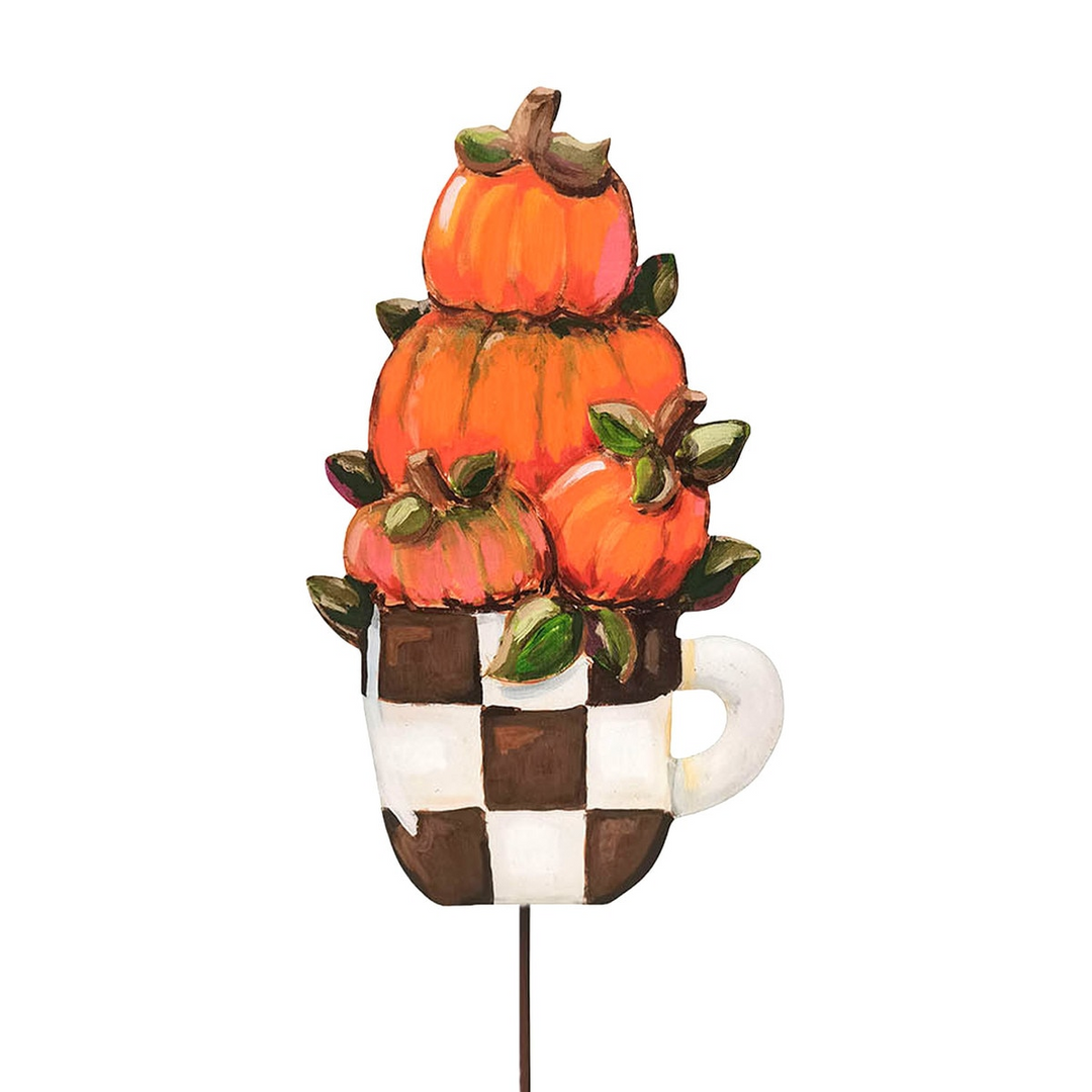 Hand-painted garden stake featuring a stack of orange pumpkins in a black and white checkered cup.
