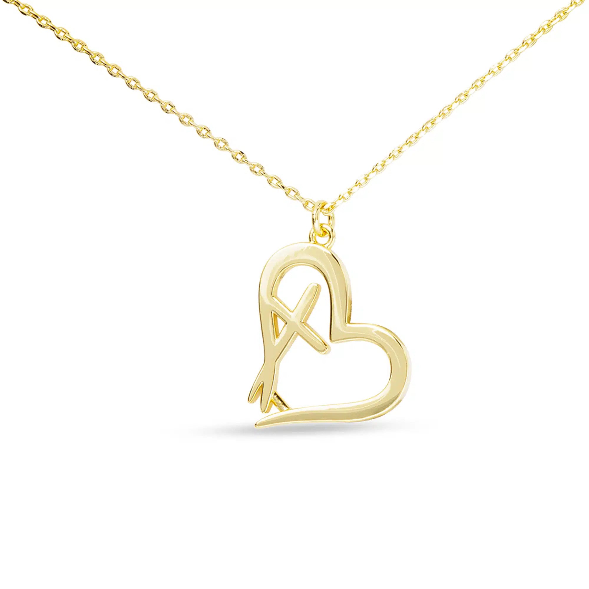 Gold necklace with a heart-shaped pendant featuring an integrated cross design.