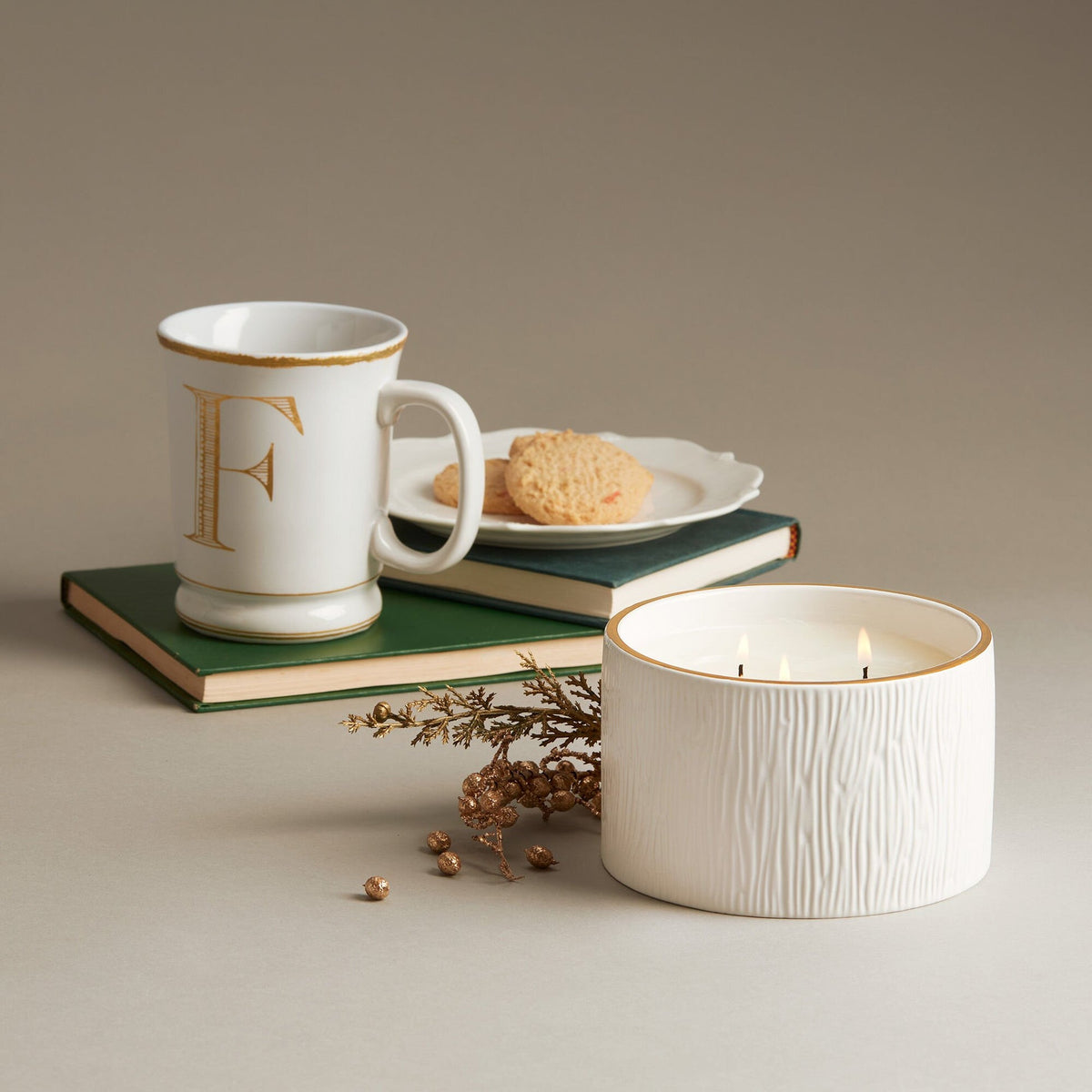 Frasier Fir 3-wick ceramic poured candle with a textured white woodgrain finish and gold rim.
