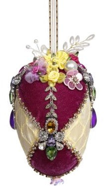 6-inch egg-shaped ornament with jeweled floral decorations on fabric-covered foam.