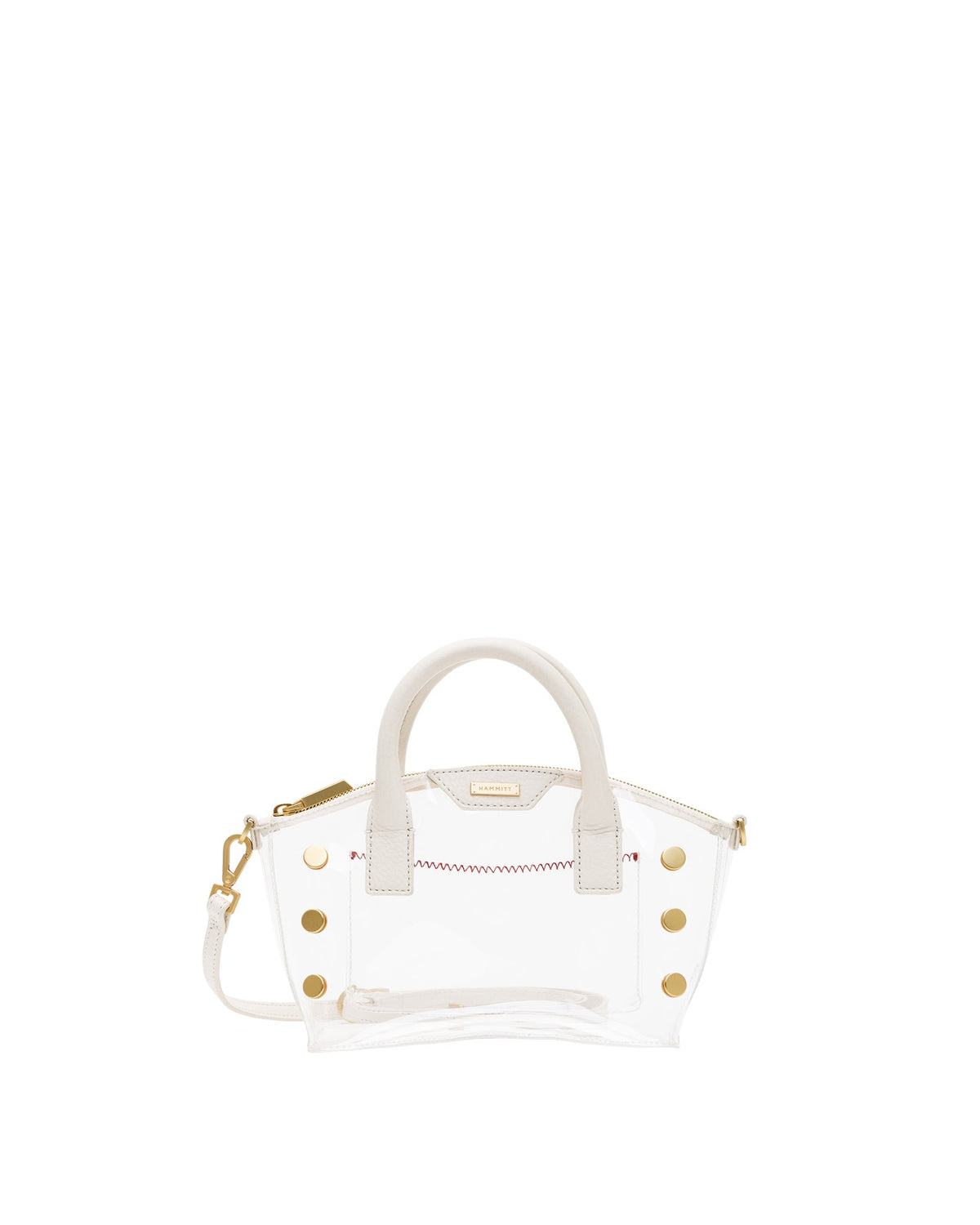Paula Clear Bag with white leather handles, gold studs, and a detachable shoulder strap.