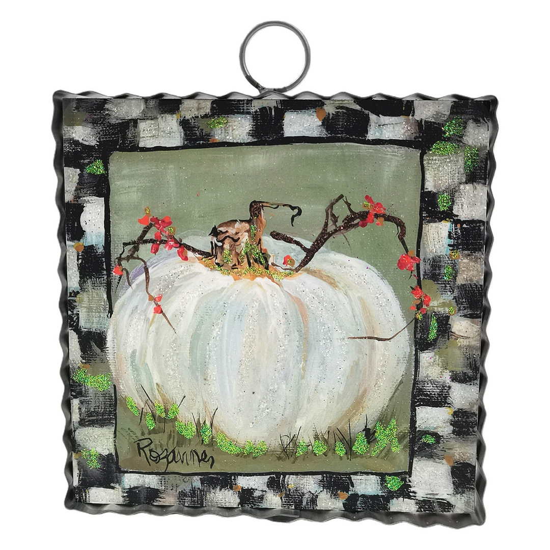 Mini art piece featuring a cream pumpkin with a checkered border and a metal hanging ring.