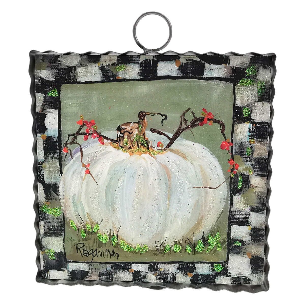 Mini art piece featuring a cream pumpkin with a checkered border and a metal hanging ring.