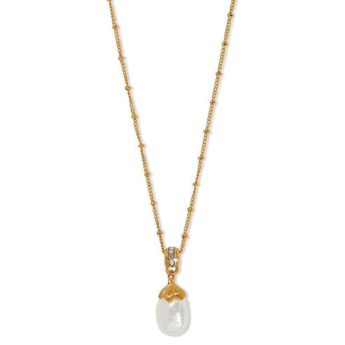 Gold-plated necklace featuring an oval rice pearl pendant with silver brushed flower accents on a gold chain.