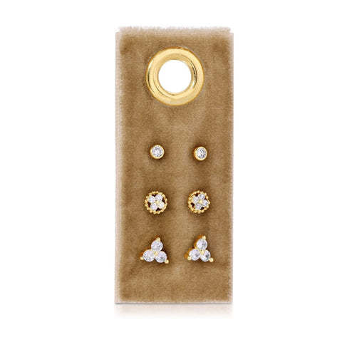 Set of three gold-plated cubic zirconia stud earrings with velvet tags