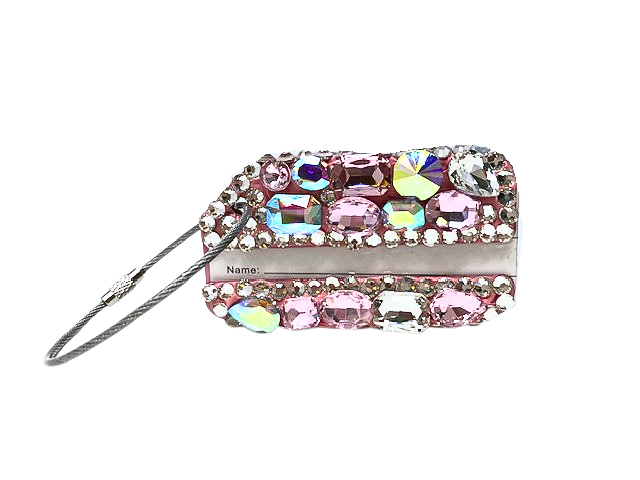 A pink rhinestone luggage tag with a wire loop and name card slot.