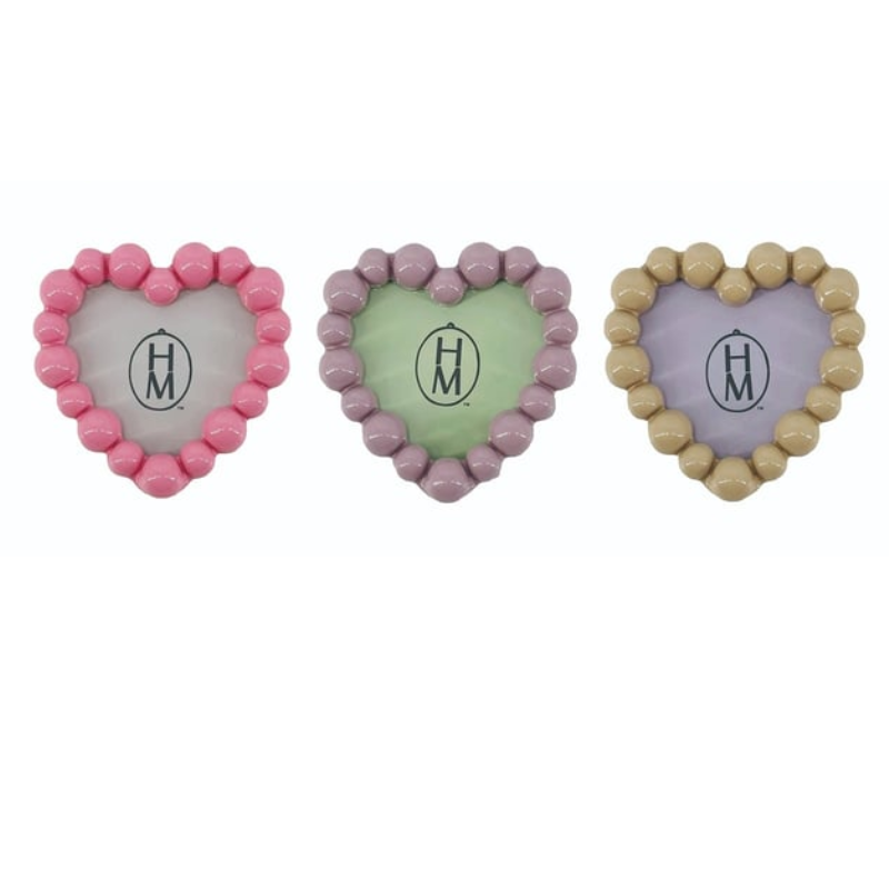 Three heart-shaped resin photo frame magnets in pink, purple, and tan with beaded borders.
