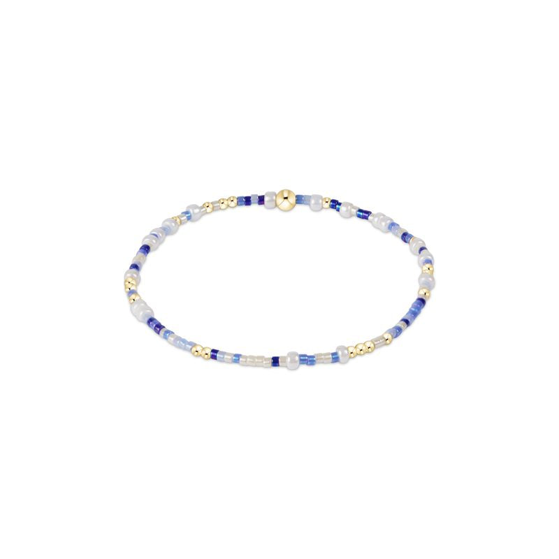 Hand-beaded Hope Unwritten bracelet featuring mixed seed beads in various colors with gold accents on elastic cord.