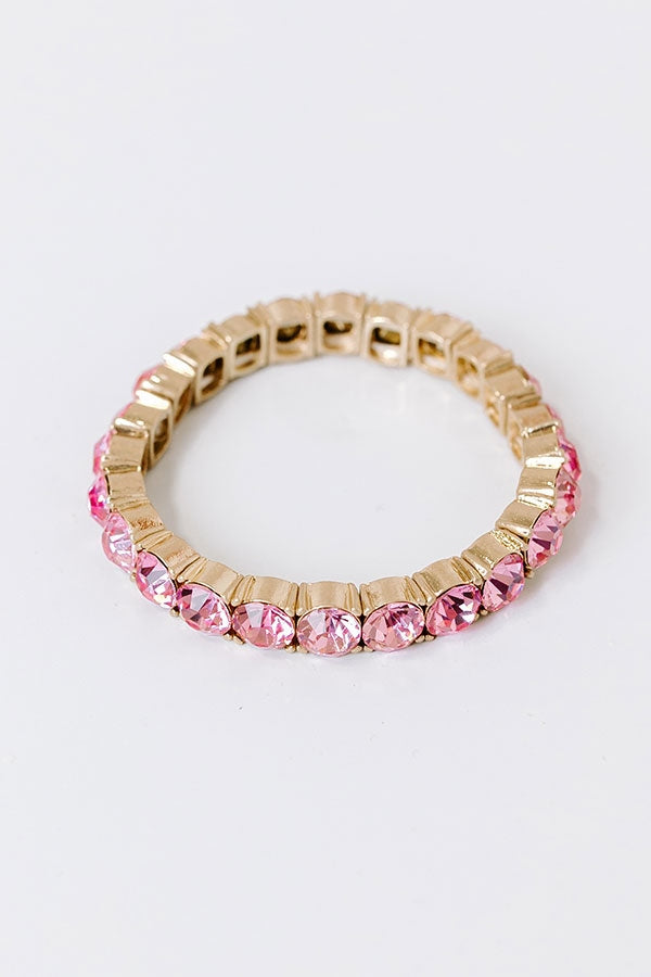 Pink sparkle stretch bracelet with a 2.5-inch diameter featuring scattered glitter accents.