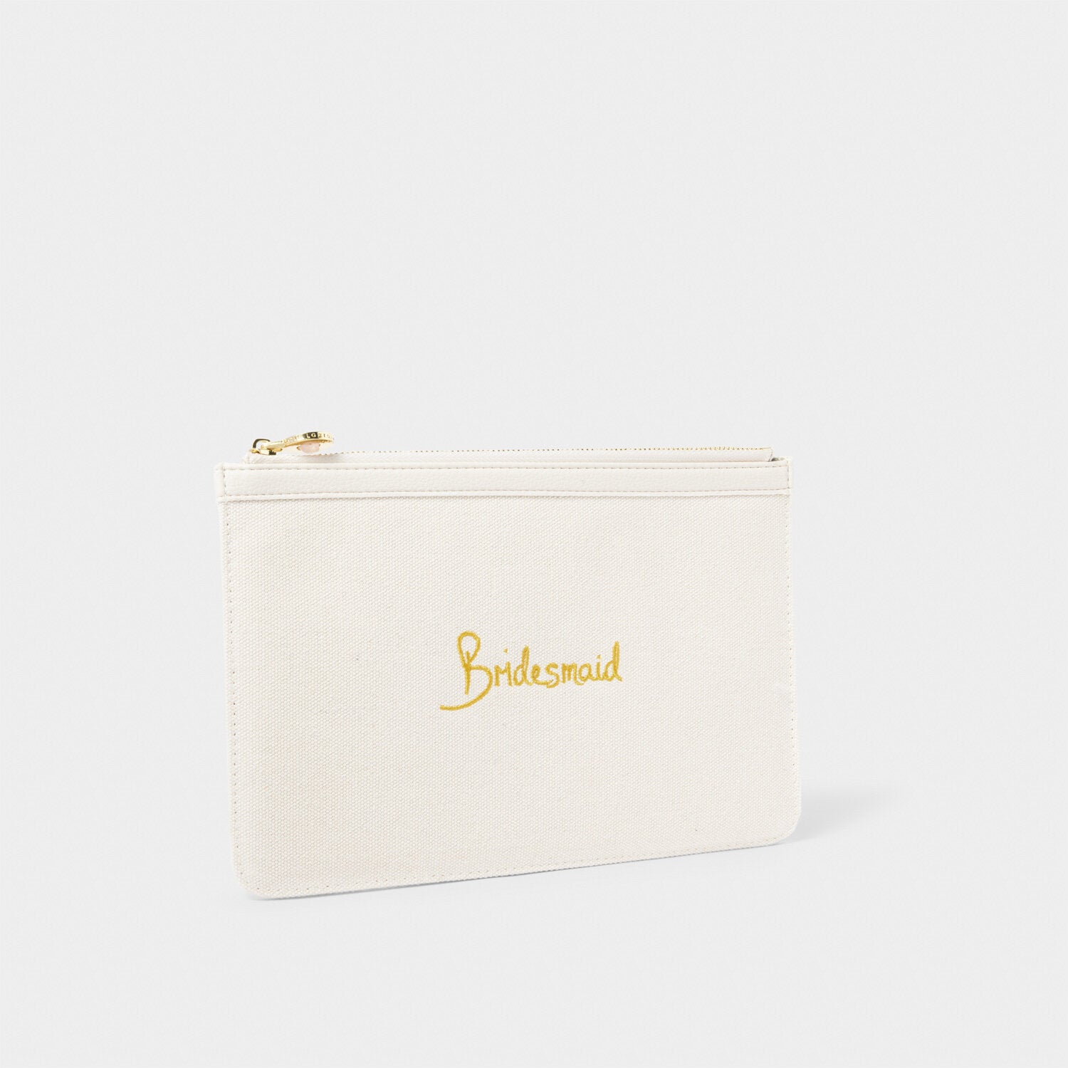 Off-white canvas pouch with gold 'Bridesmaid' embroidery and a gold-tone zipper.