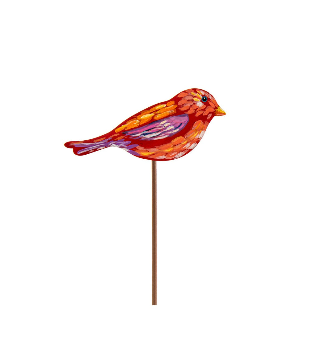 Red and orange painted bird stake with purple and yellow accents.