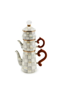 Check stackable coffee set with a grey and white checkered pattern and brown handles.