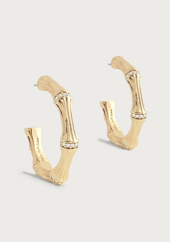 Gold-plated bamboo-textured medium hoop earrings with crystal pavé accents.