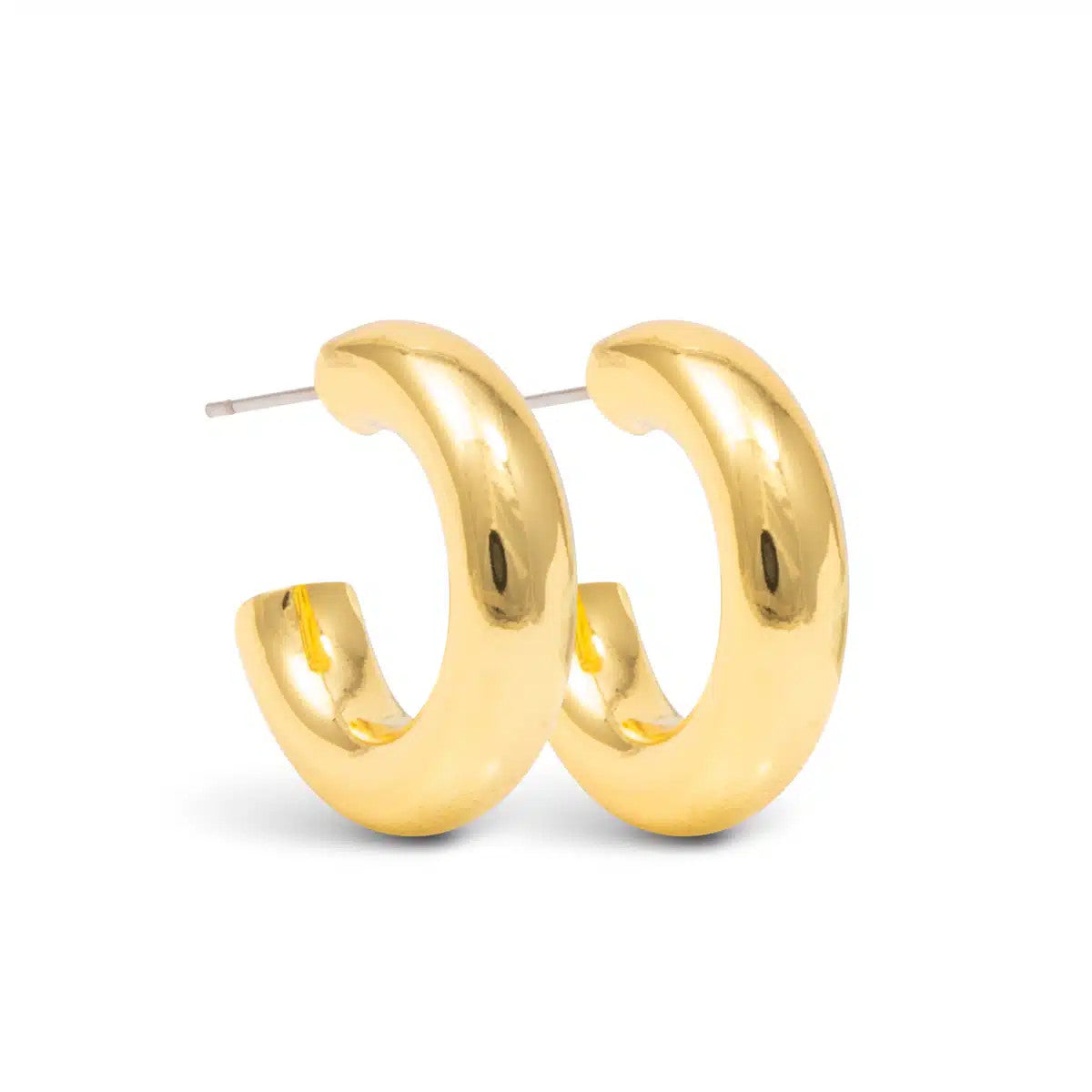 Pair of Kate Polished Huggie Gold Earrings with a thick, rounded hoop design and post back.