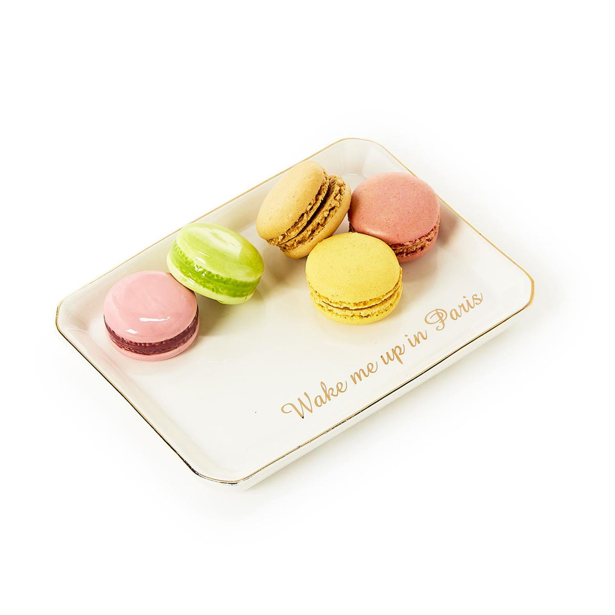 Ceramic trinket tray with five colorful macarons and gold text reading Wake me up in Paris.