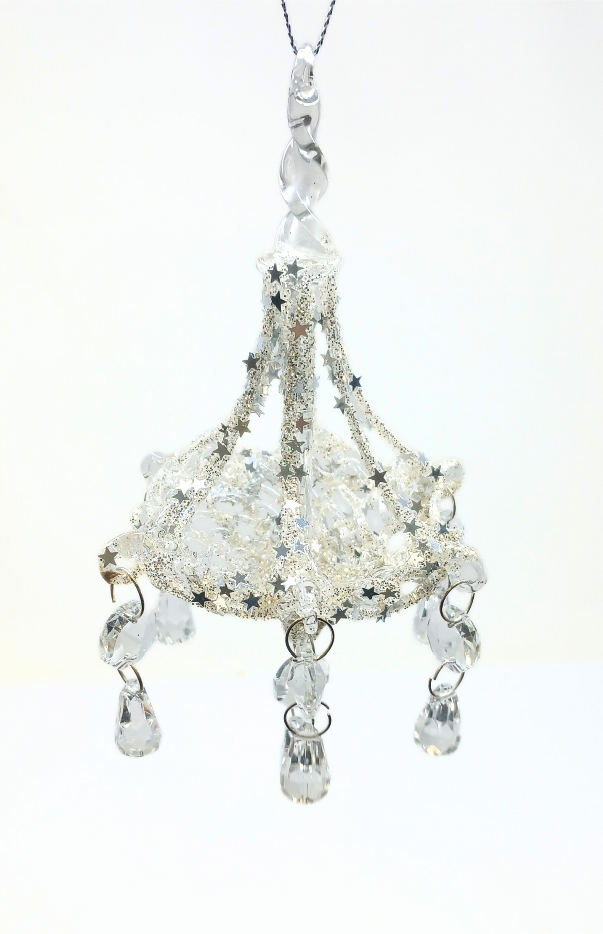 A 6-inch chrome chandelier ornament with silver glitter, star accents, and hanging crystal drops.