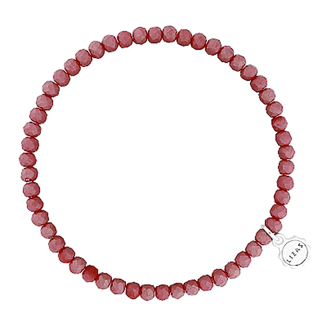 Lizas Quadro Big Bright Colours Bracelet featuring faceted red crystal beads and a silver logo charm.