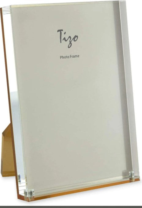 Modern Lucite photo frame with gold back finish holding an 8x10 inch photograph.