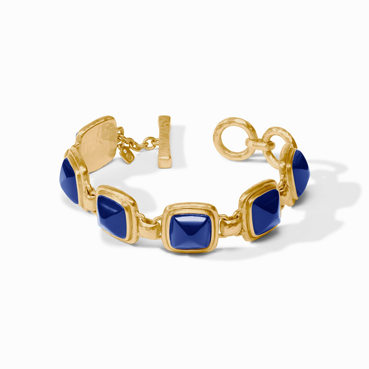 Sahara Stone Bracelet in 24K gold plate with square blue glass stones and a toggle closure.