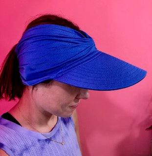 Women's bright colored open-top sun visor hat with wide brim and elasticized chinlon fabric