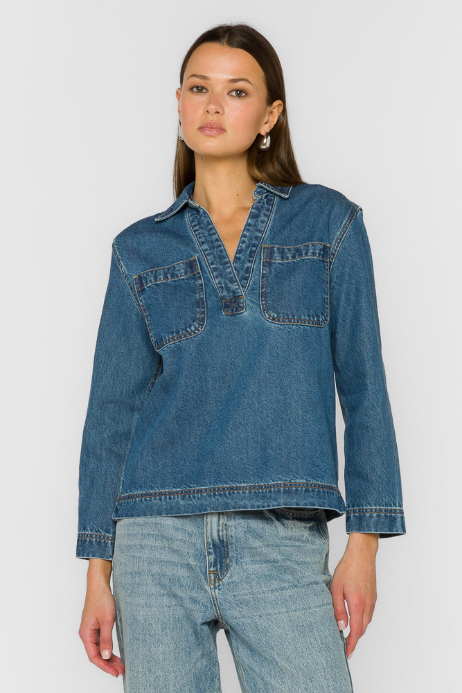 Relaxed fit denim popover top with chest pockets in a light wash.