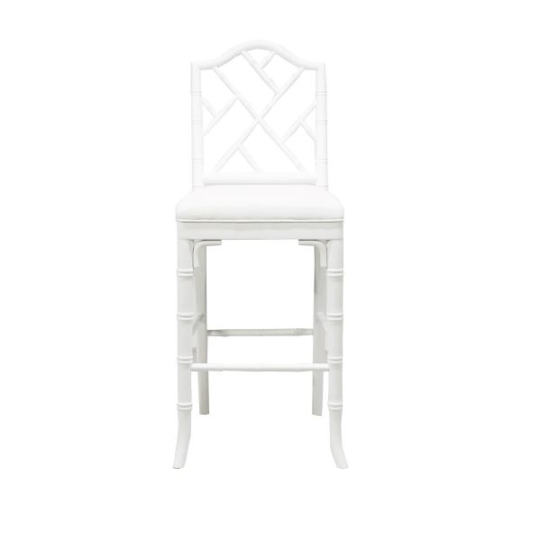 White Annette counter stool with a curved backrest and tapered wooden legs.