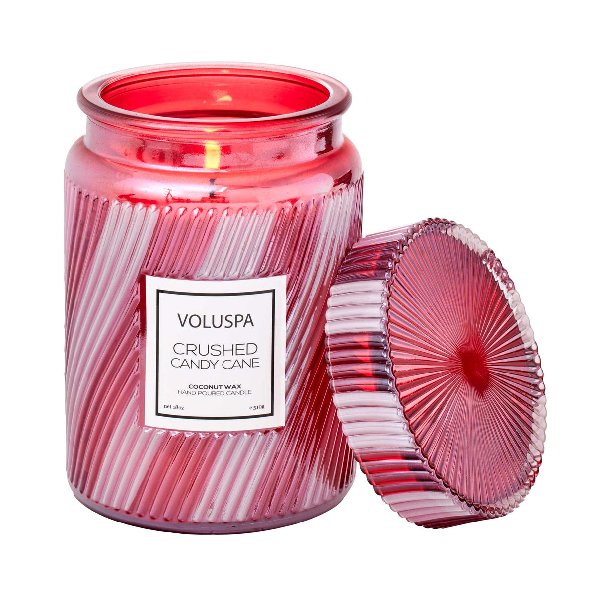 Large jar candle with crushed candy cane peppermint swirls in a clear glass container.