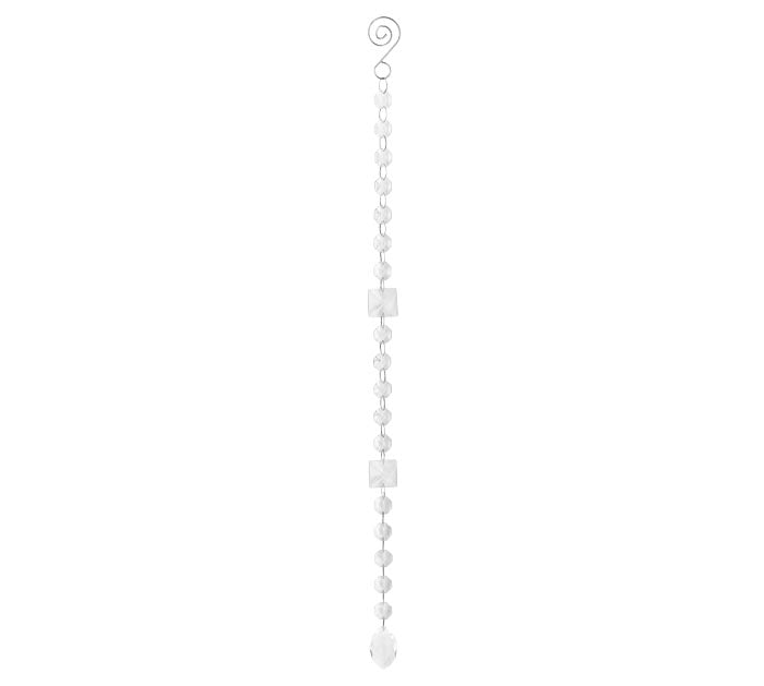 Clear glass strand featuring faceted round and square beads with an oval pendant at the bottom.