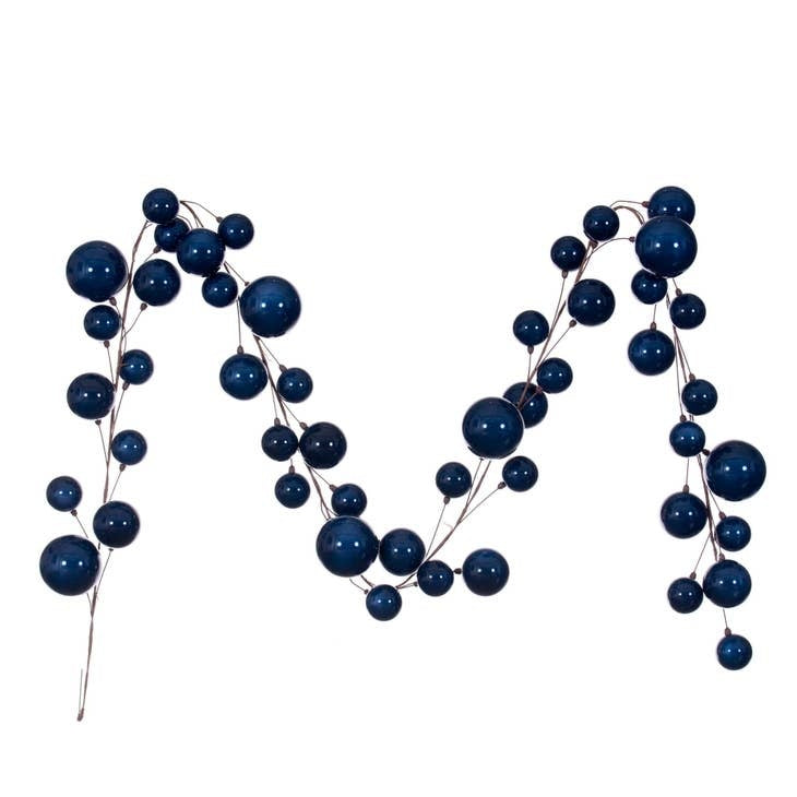 10-foot midnight blue pearl ball garland on a thin metal branch for indoor decoration.