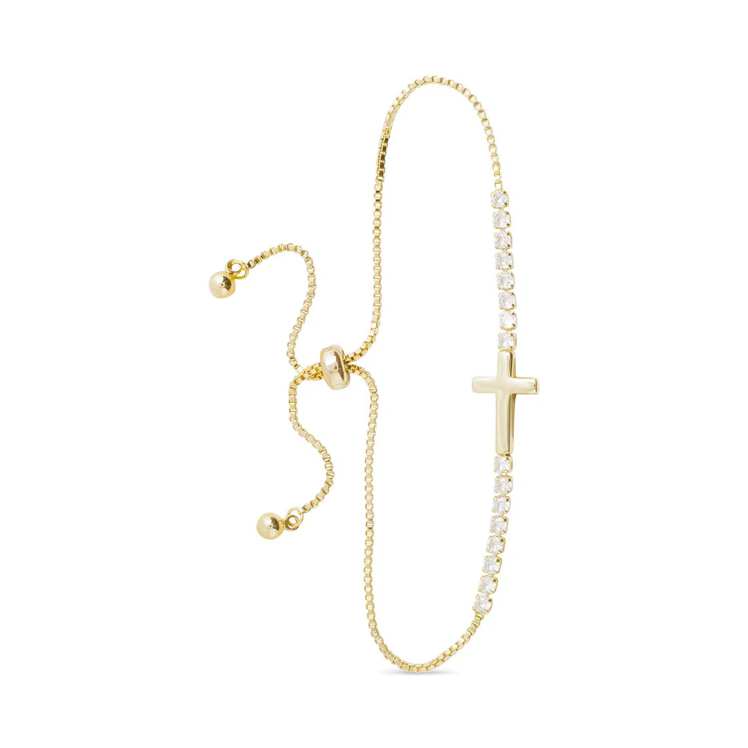 Gold pull-cord bracelet featuring a smooth gold cross and a line of sparkling CZ stones.