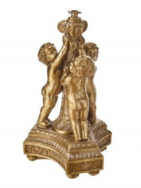 Gold-finished resin tree holder featuring three sculpted cherubs standing on an ornate base.