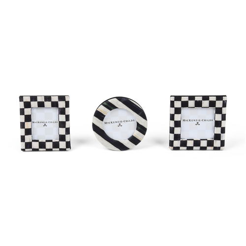 Set of three black and white patterned fabric frames in square, round, and rectangular shapes.