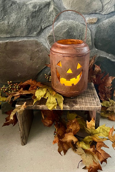 8.5-inch tall pumpkin lantern with a natural orange finish.