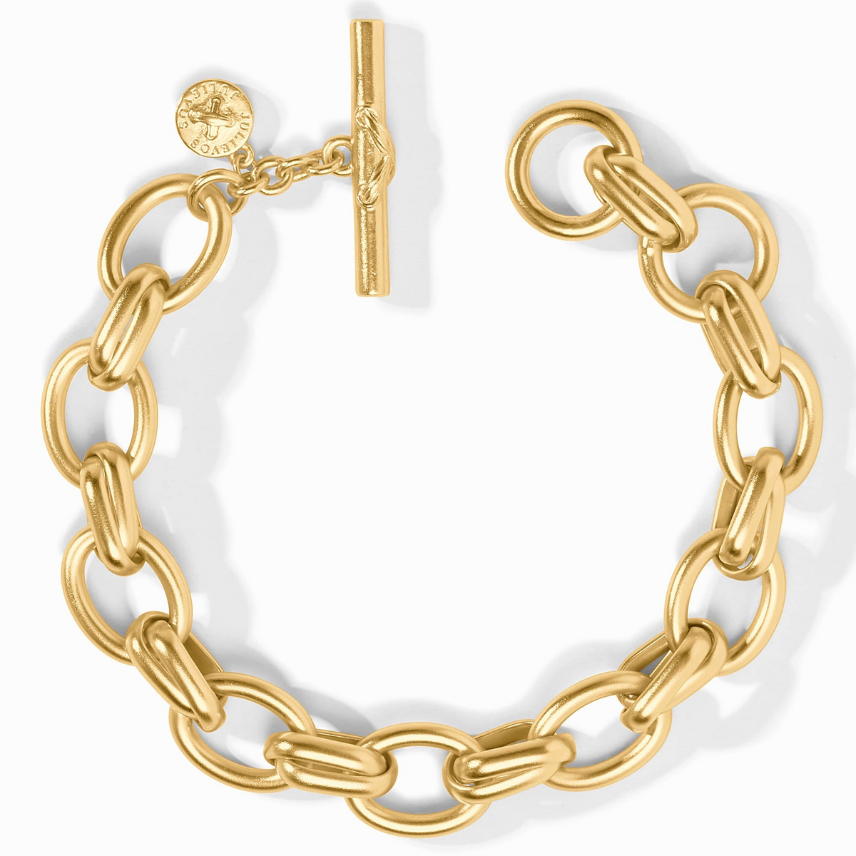 Gold Essex Link Bracelet with a toggle clasp and a small circular logo charm.