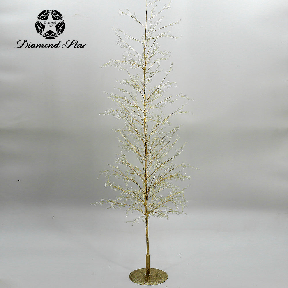 Gold decorative Christmas tree with crystal accents on a glittery base