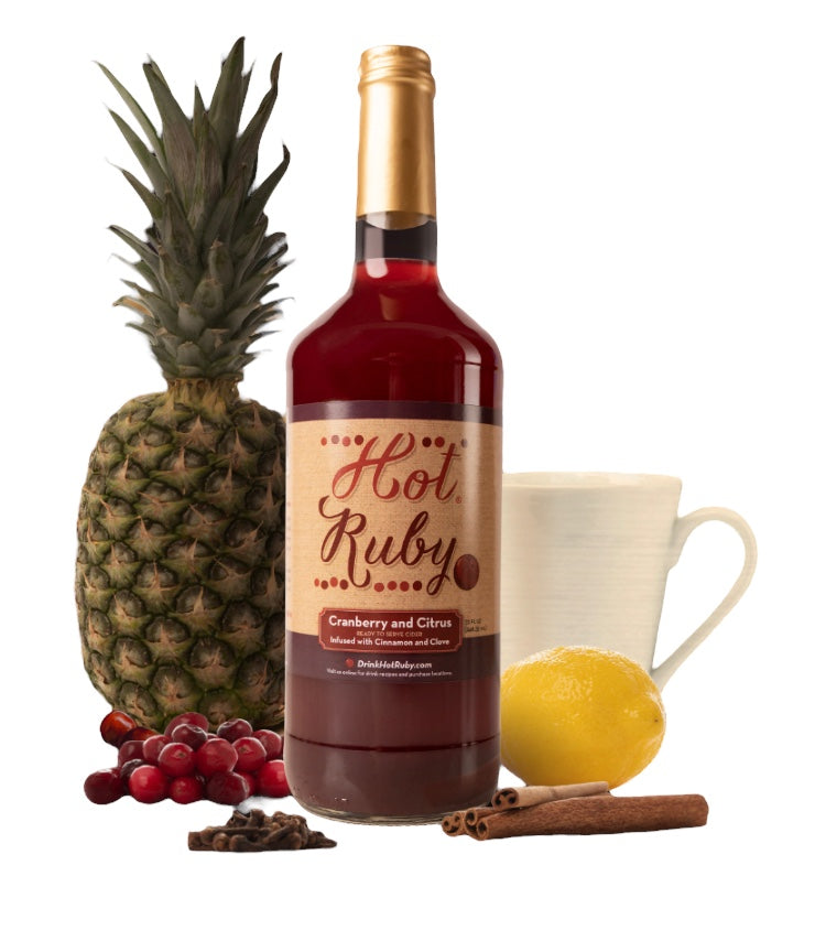 Bottle of Hot Ruby Cranberry Cider with cinnamon spices