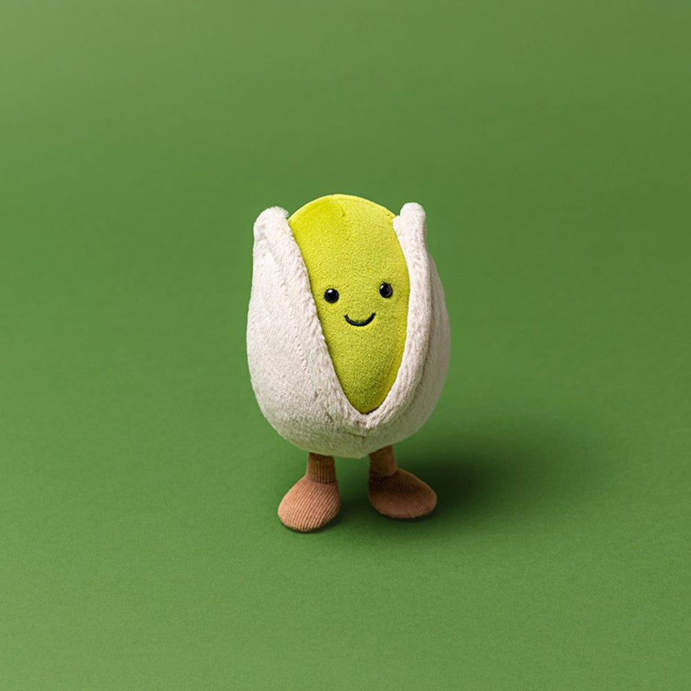 Amuseables Horatio Pistachio plush toy with a green nut, white shell, and brown corduroy legs.