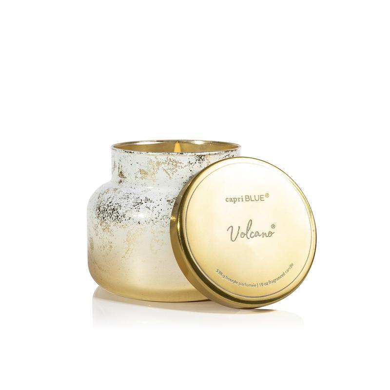 Volcano Glimmer Signature Jar candle in a clear glass jar with black wicks and shimmering glitter details.