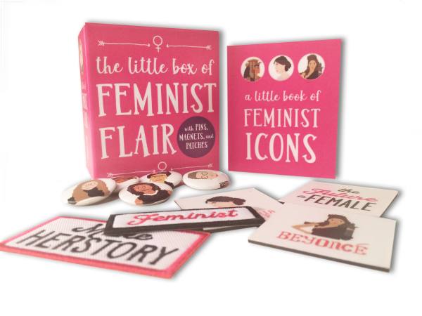 Gift box containing feminist pins, patches, magnets, and a miniature book featuring icons like Ruth Bader Ginsburg.