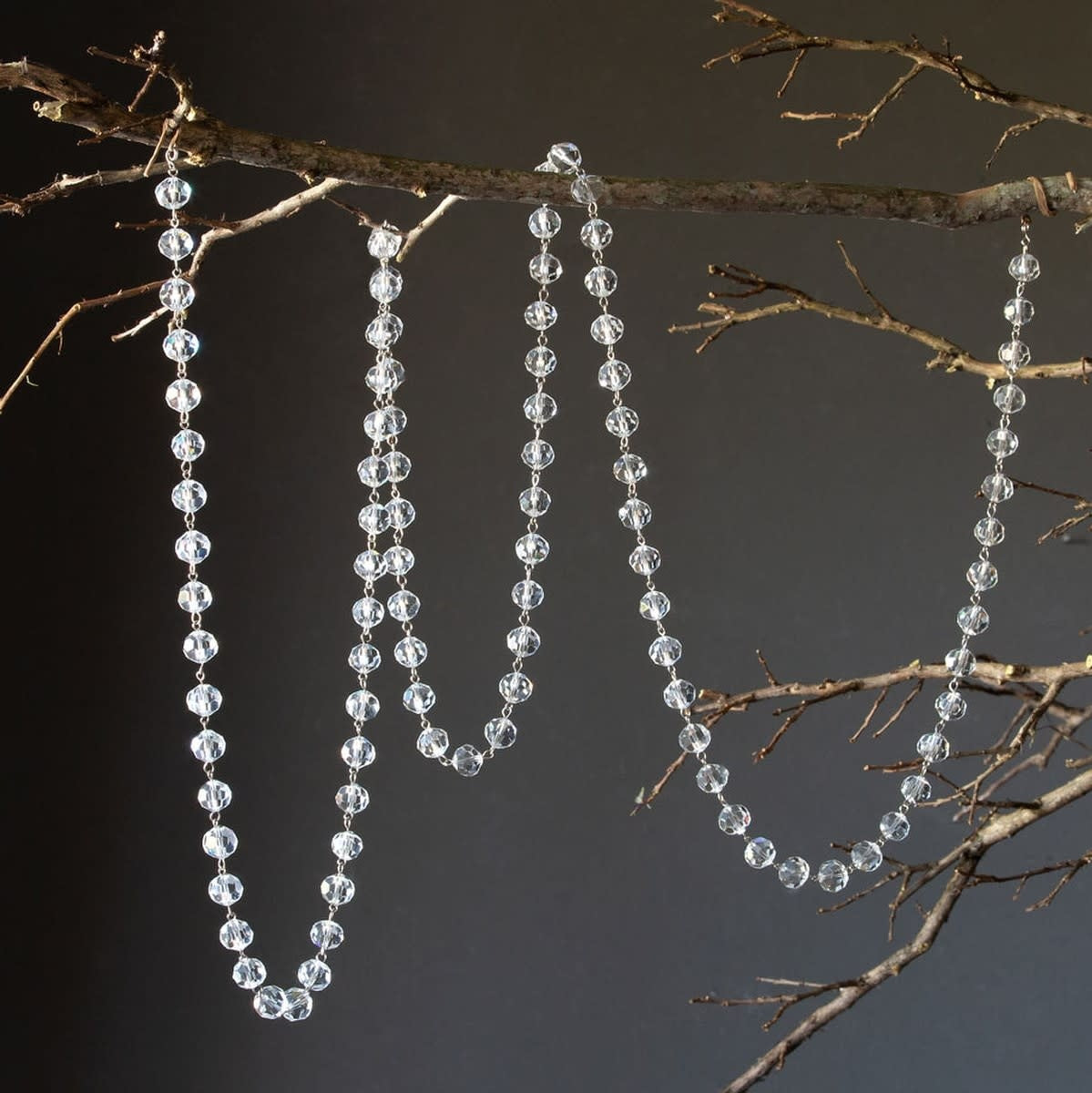 A long glass crystal garland with faceted beads in clear color.