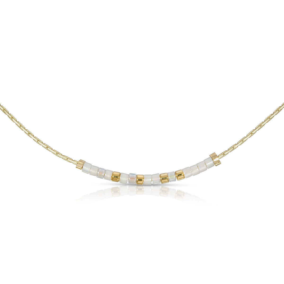 Faith necklace featuring iridescent pearl and cream gold glass beads in a Morse code pattern.