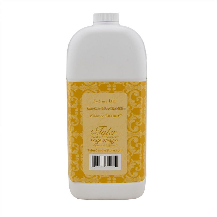 A 3.78L white plastic bottle of Tyler Candle Company detergent with a yellow patterned label.