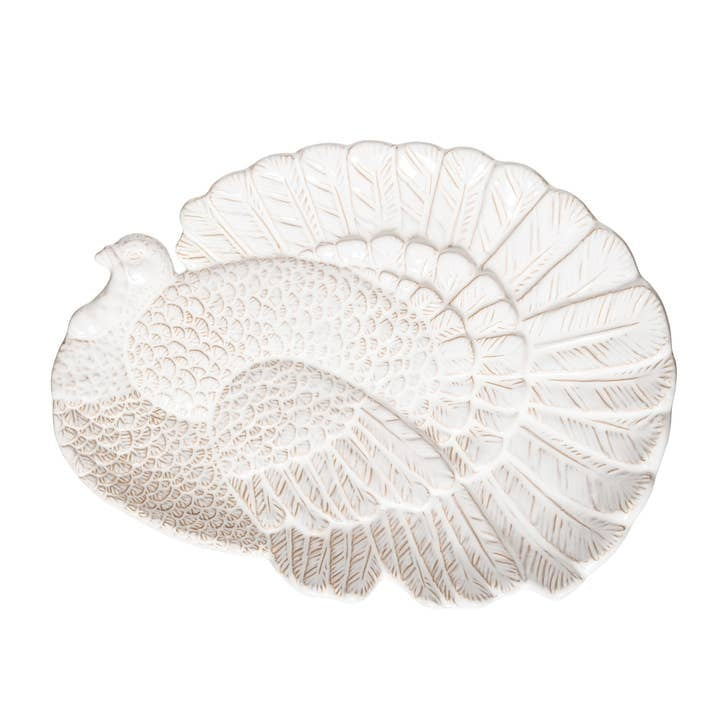 White stoneware serving platter with embossed turkey silhouette in fall harvest theme.