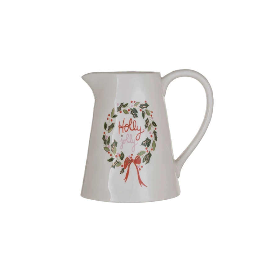 1 Quart white stoneware pitcher with a Holly Jolly wreath design and gold electroplating.