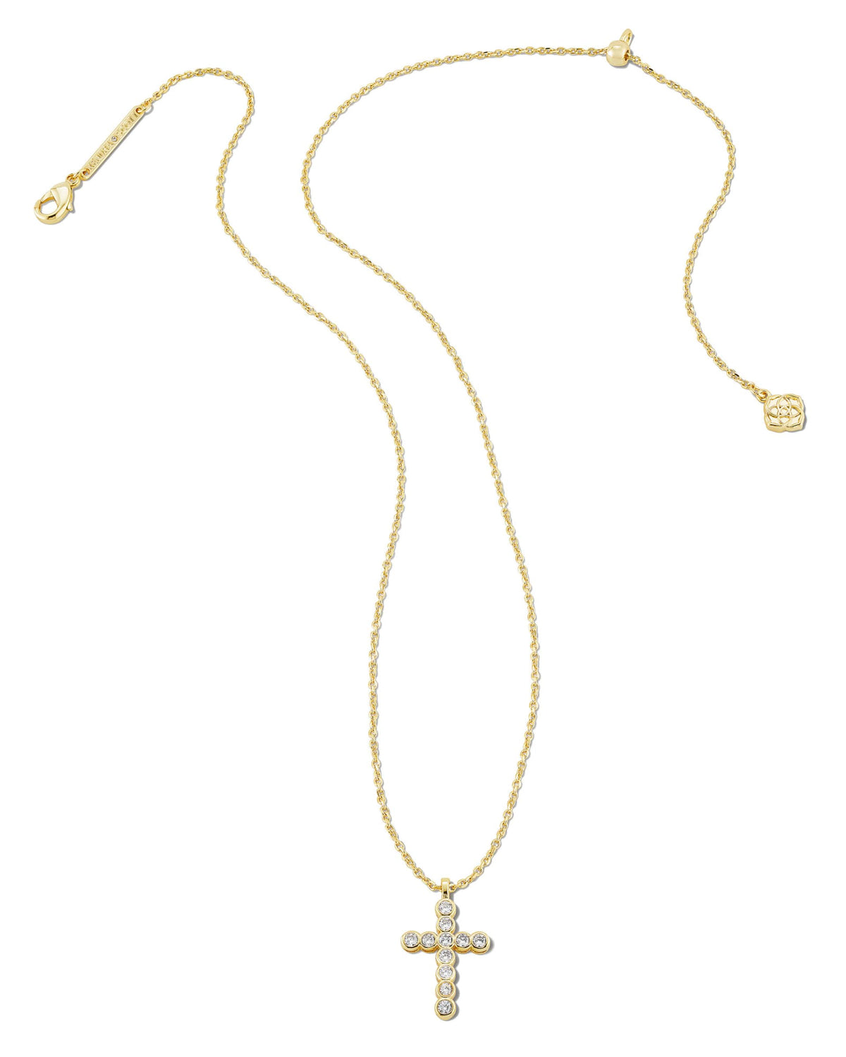 Gold cross pendant necklace with clear crystals on an adjustable chain with a lobster clasp.