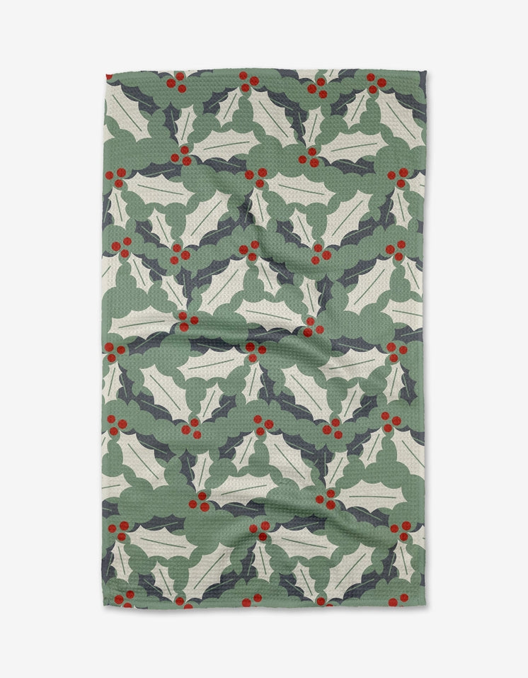 Holiday tea towel with waffle weave construction in red featuring festive snowflake pattern