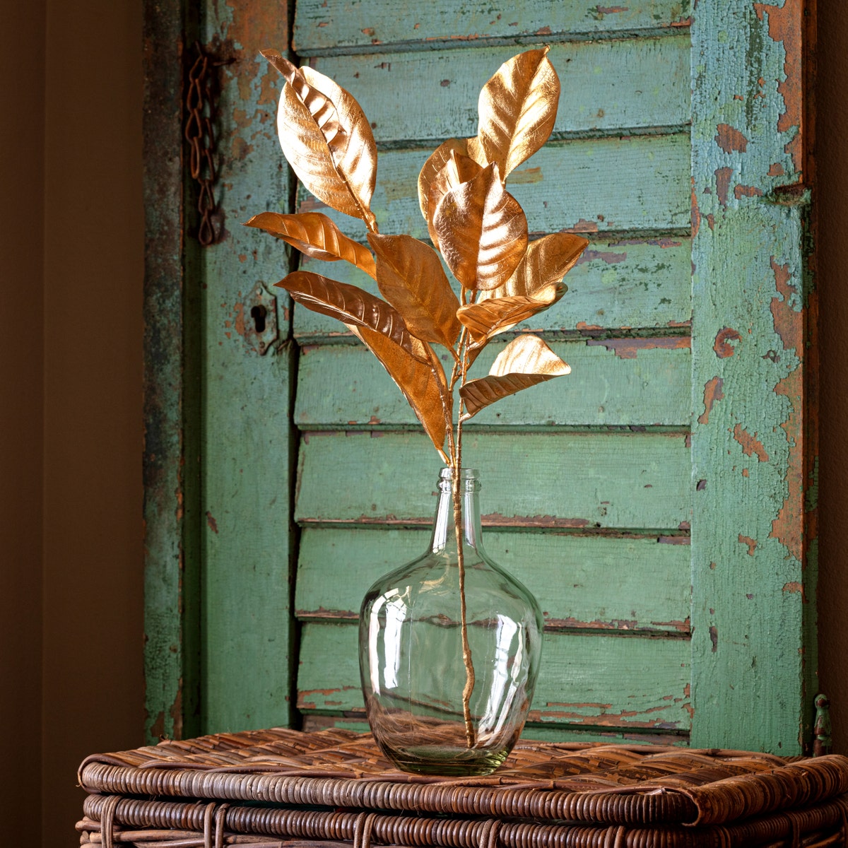 Gold metallic magnolia stem with detailed petal texture