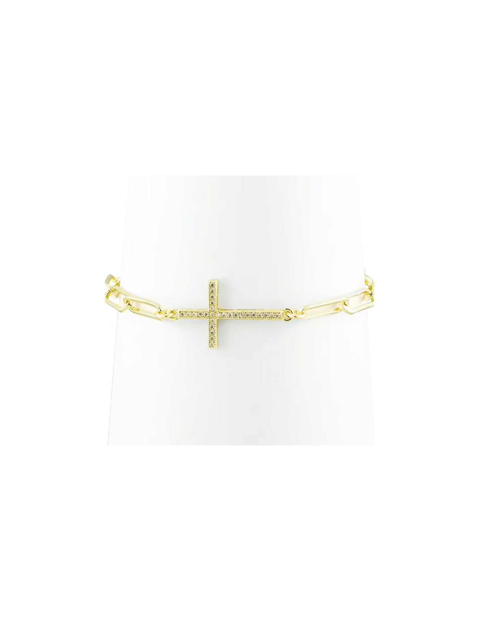 Gold link bracelet featuring a horizontal cross pendant set with small clear crystals.
