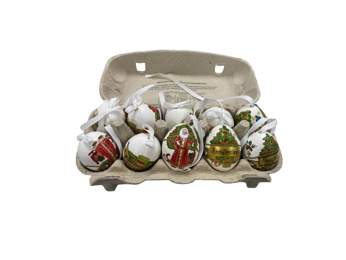 Hand-painted Santa and Christmas tree egg ornaments in a carton, made in Austria.