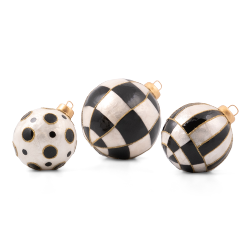 Three black and white Courtly Capiz Tabletop Ornament Balls in dot, check, and stripe patterns.